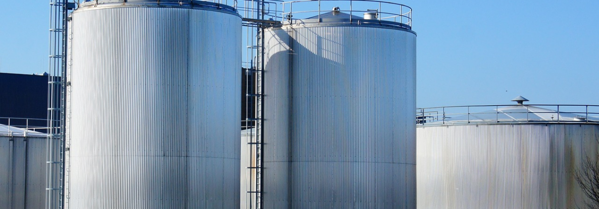 large fiberglass storage tanks in a chemical factory