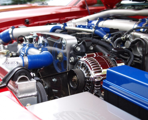 A blue, silver, and black engine of a car